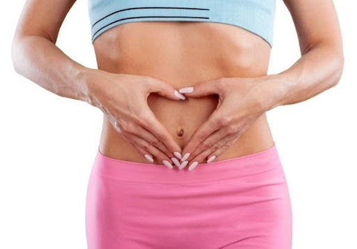 Woman's gut health in yoga pants