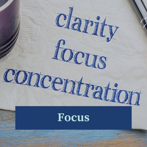 A bit of parchment with the words clarity, focus, and concentration on it to promote focus